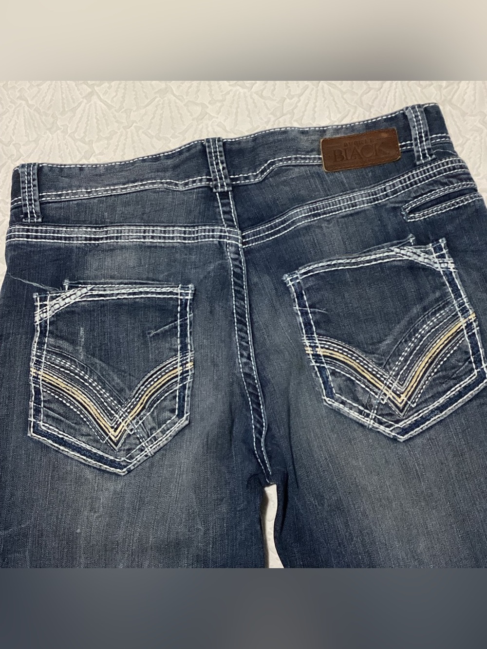 Buckle Black Bootleg Distressed Jeans